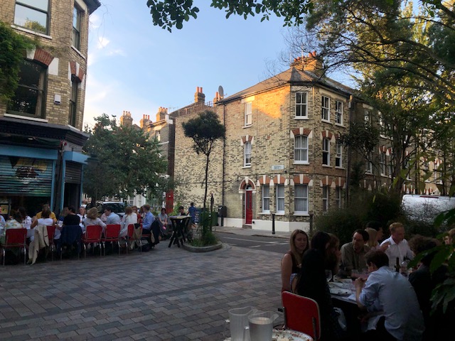 Outdoor dining setup at Italo Delicatessen, perfect for networking events and gatherings.