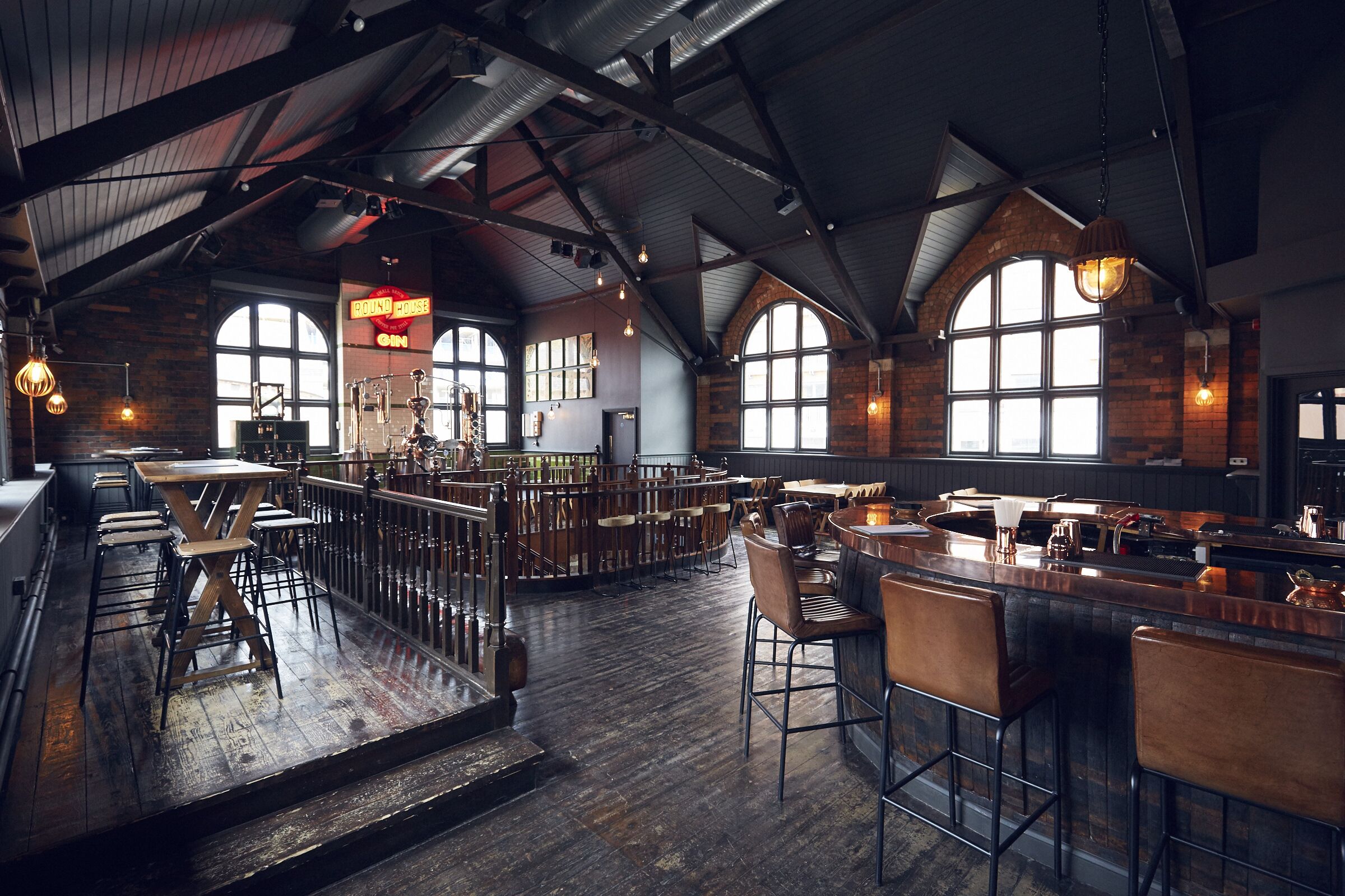 Stylish Gin Terrace event space with high ceilings, ideal for networking and gatherings.