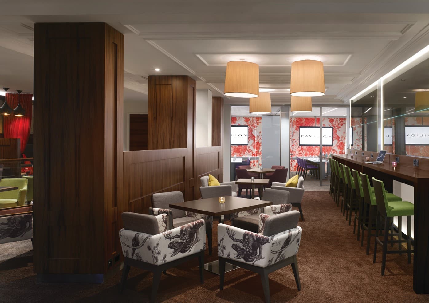 Versatile break-out space with bar seating at Pavilion Kensington for networking and meetings.