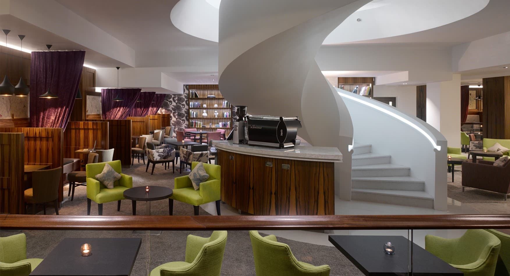 Lounge space with central staircase at Pavilion Kensington for executive networking and receptions.