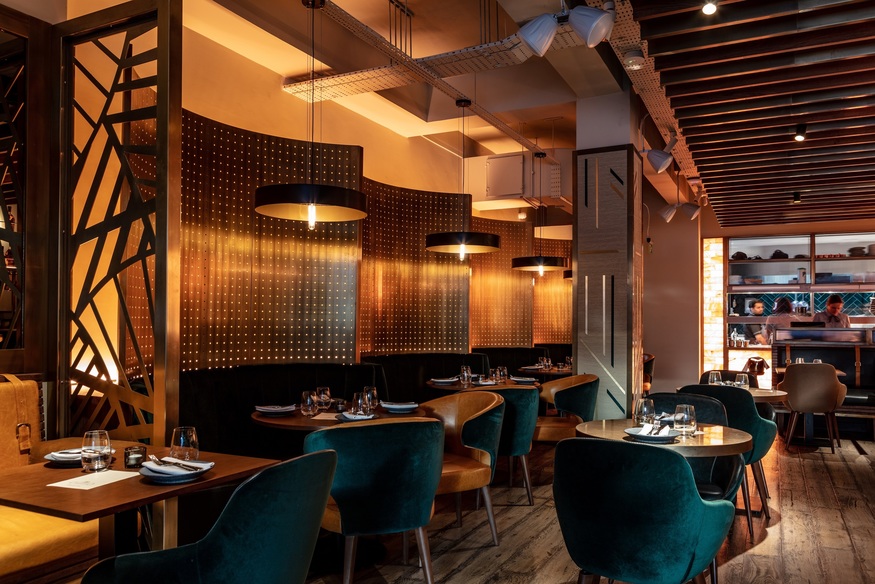 Stylish restaurant interior in Farzi London, ideal for intimate meetings and events.