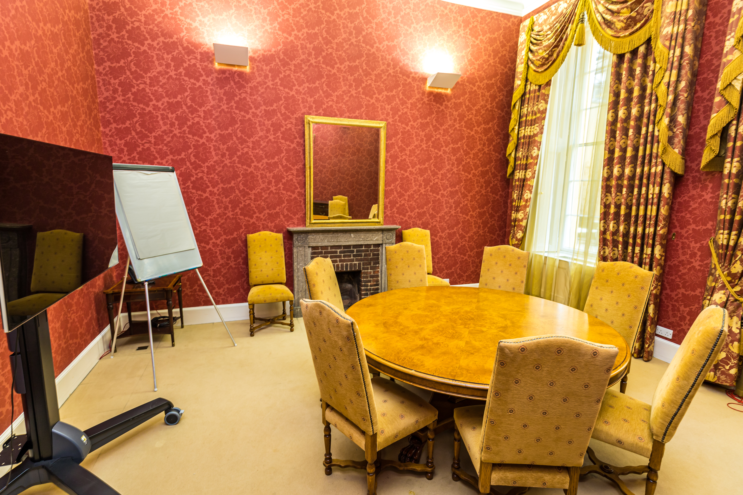 Ditton Manor House meeting room with round table, ideal for conferences and presentations.