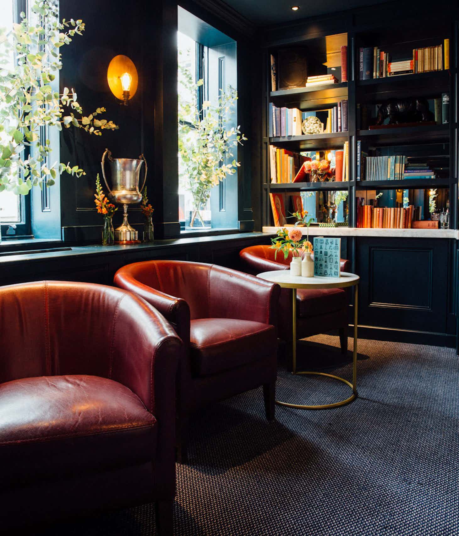 Stylish lounge area in The Library, Quo Vadis, ideal for networking events and meetings.