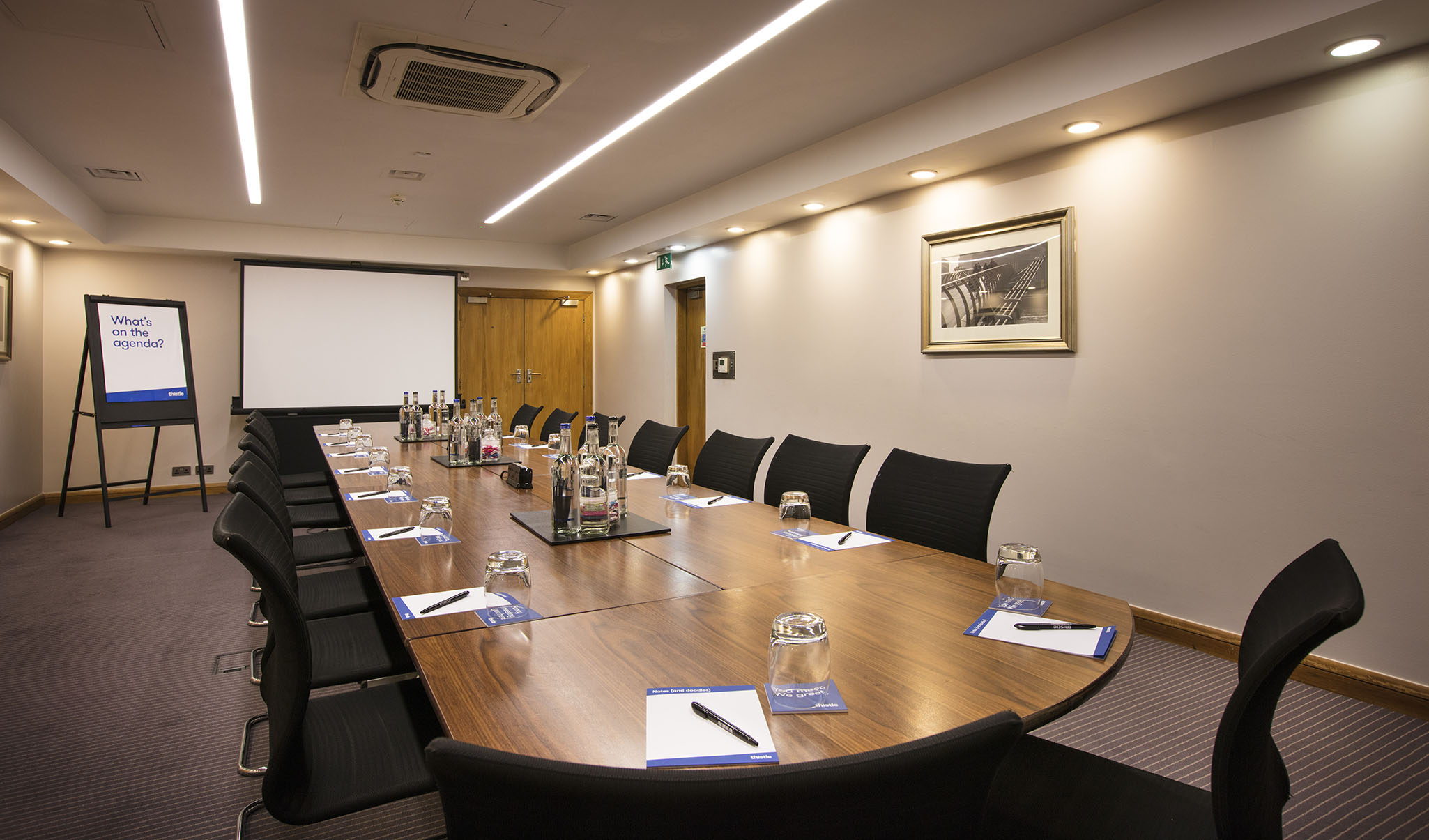 Meeting room at Fitzroy, Thistle Holborn, with wooden table for professional workshops.
