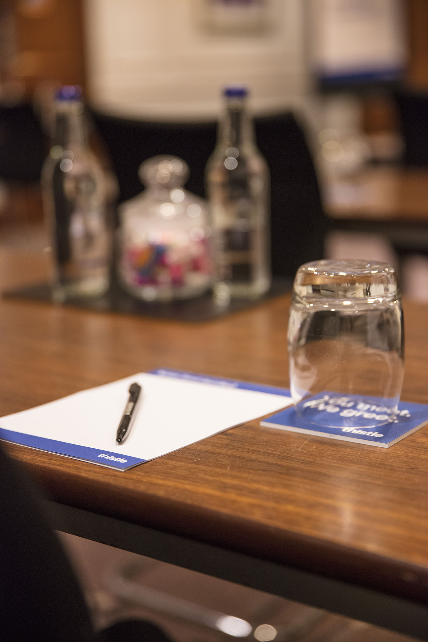 Meeting setup with notepad and pen in a professional workspace for collaboration.