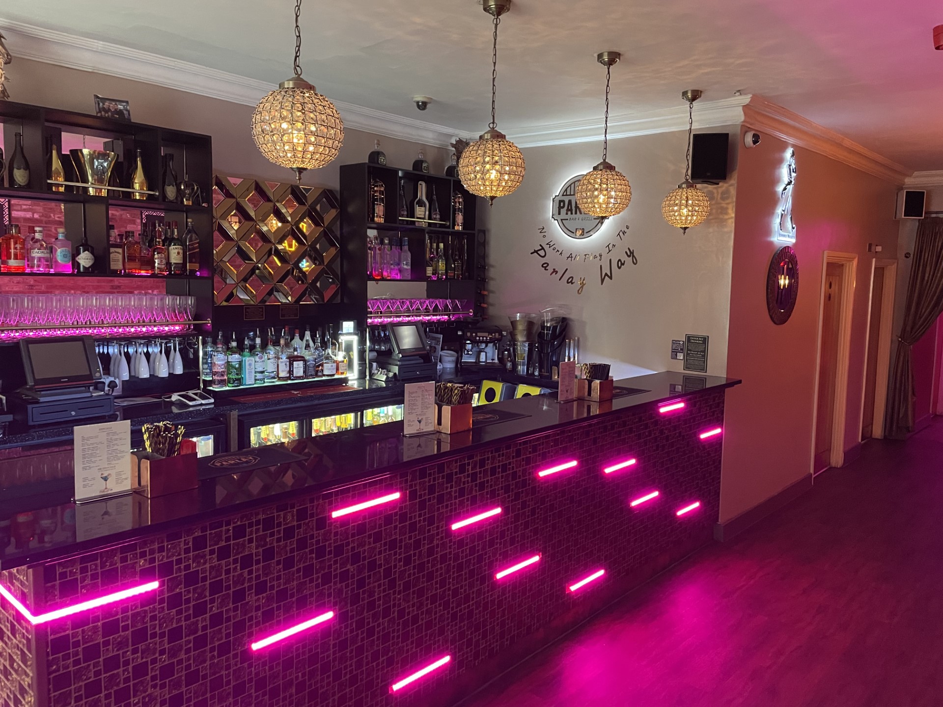 Stylish bar area with pendant lighting, perfect for cocktail receptions and events.