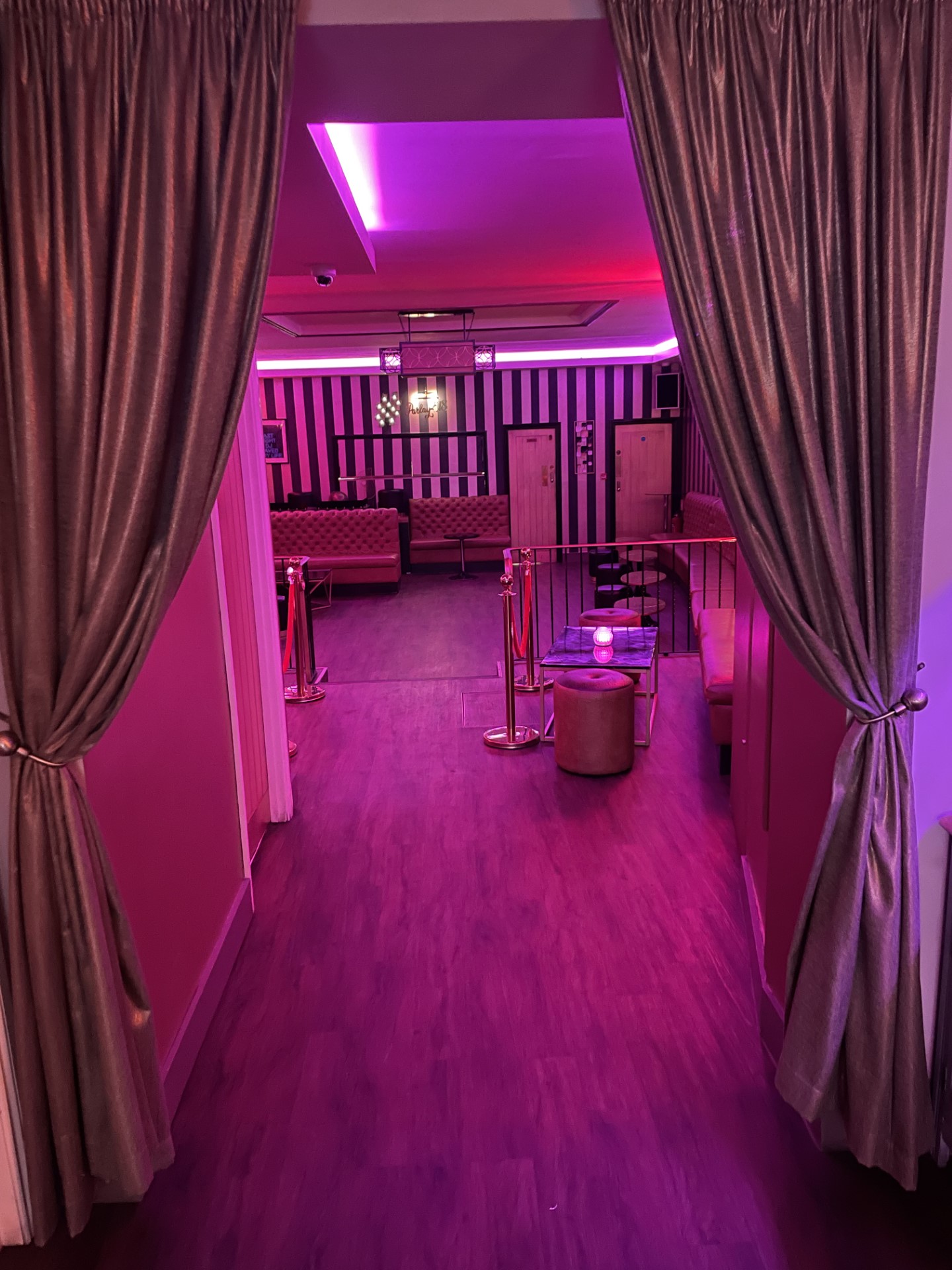 Stylish event space at Parlay E18 Bar & Grill with plush seating and vibrant lighting.