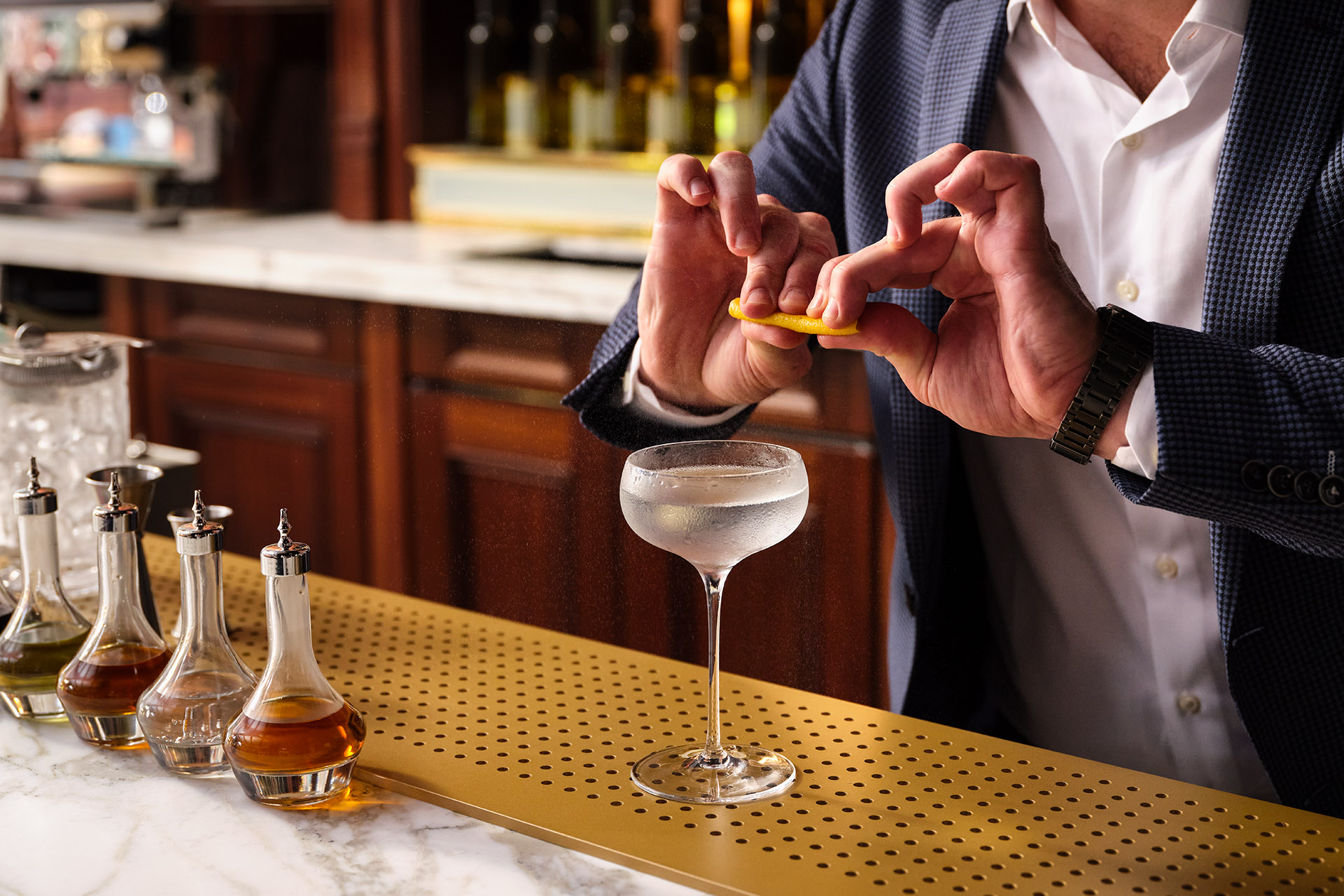 Bartender crafting a cocktail at The NoMad London for upscale corporate events.