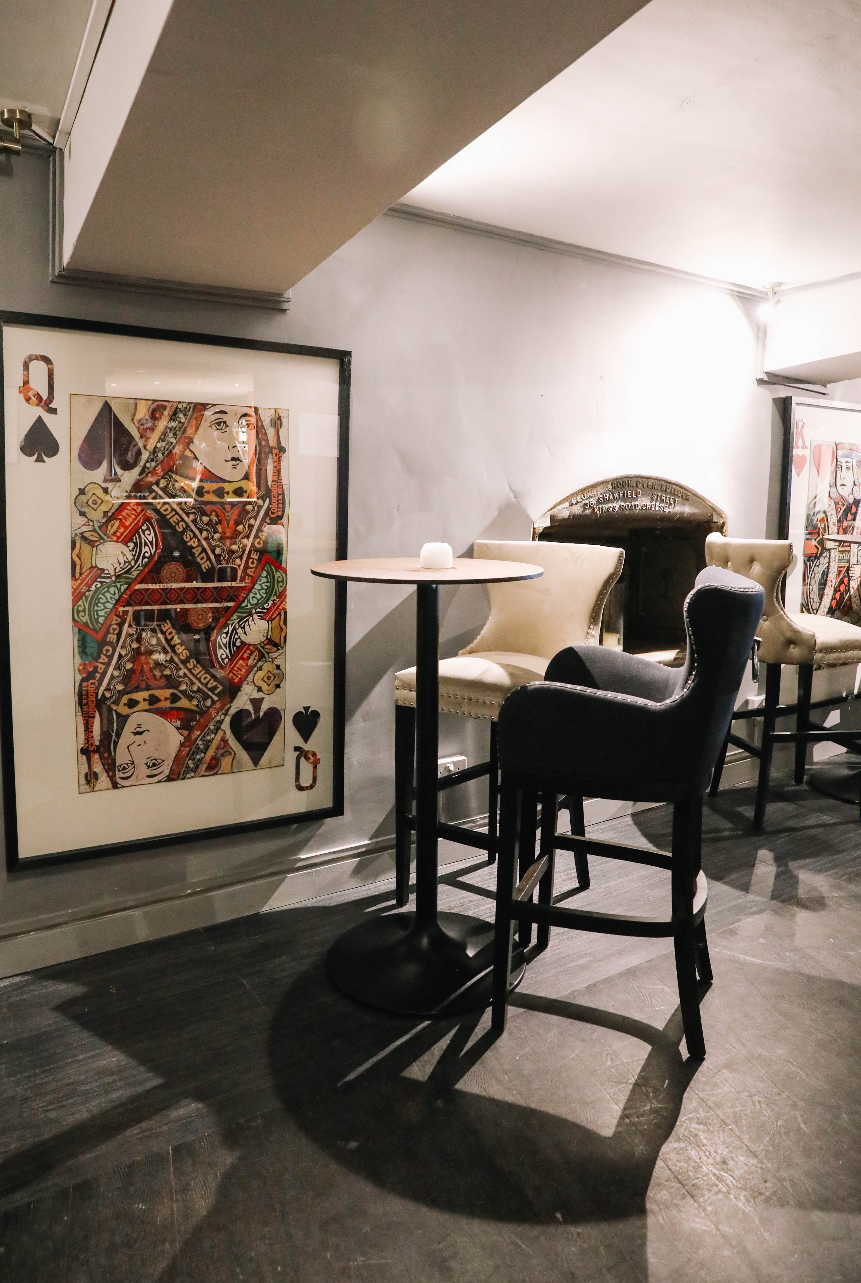 Sandy's Piano Bar with high-top tables and bold artwork, ideal for networking events.