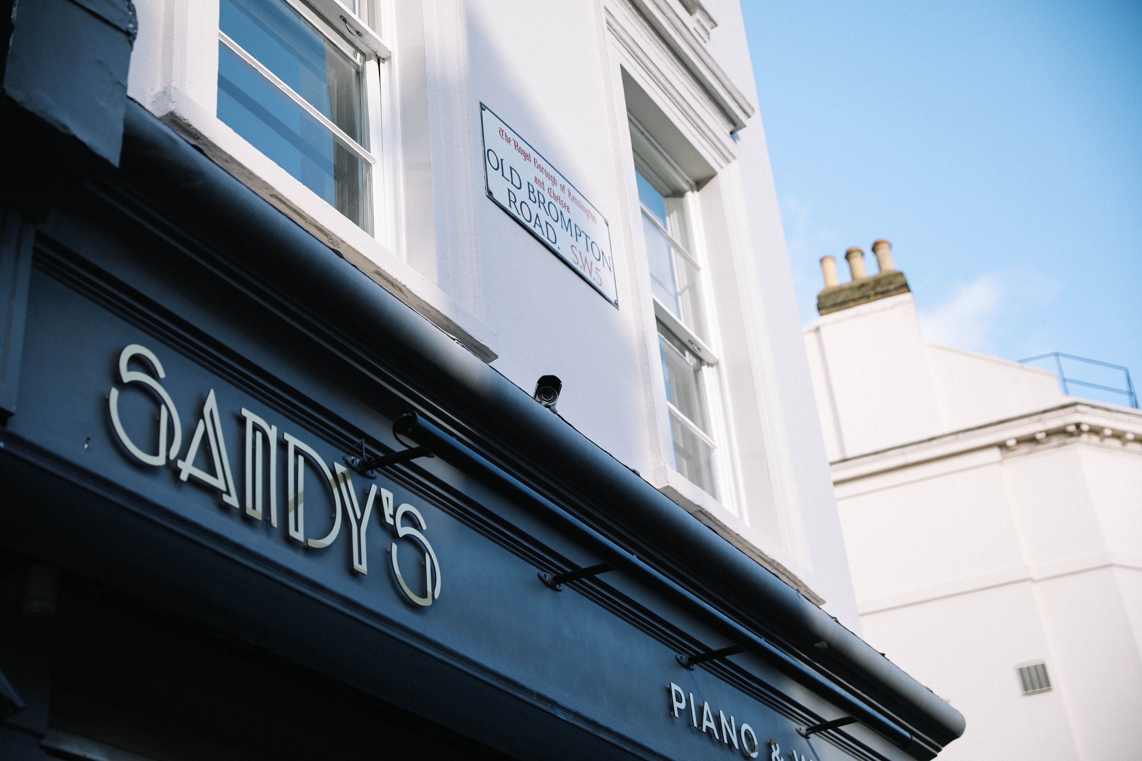 Sandy's Piano Bar venue with elegant facade, perfect for intimate events and gatherings.