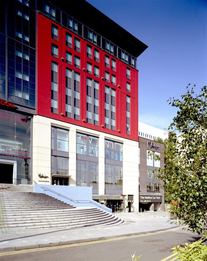 Modern event venue Work + Play 4 in Birmingham with striking red facade and natural light.