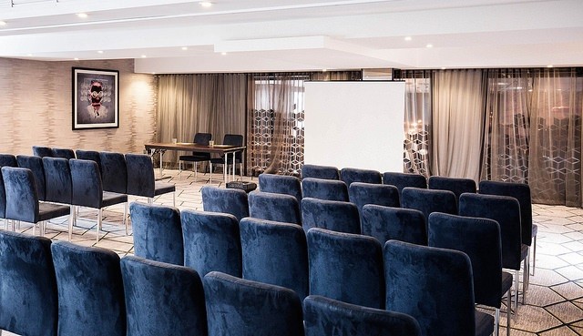 Meeting space in Malmaison Birmingham with projector screen for corporate events.