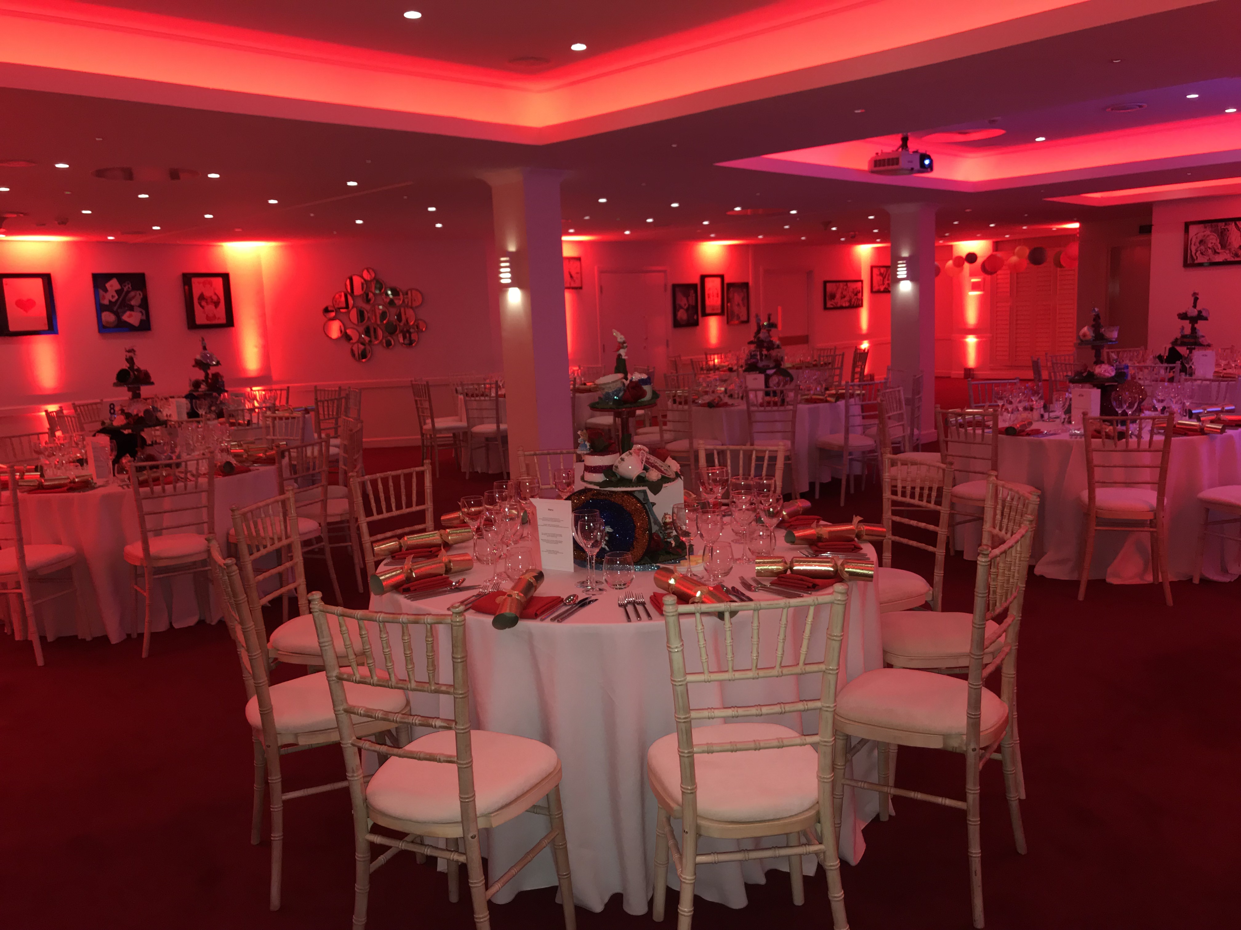 Elegant banquet room at No.11 Cavendish Square with red lighting for events.