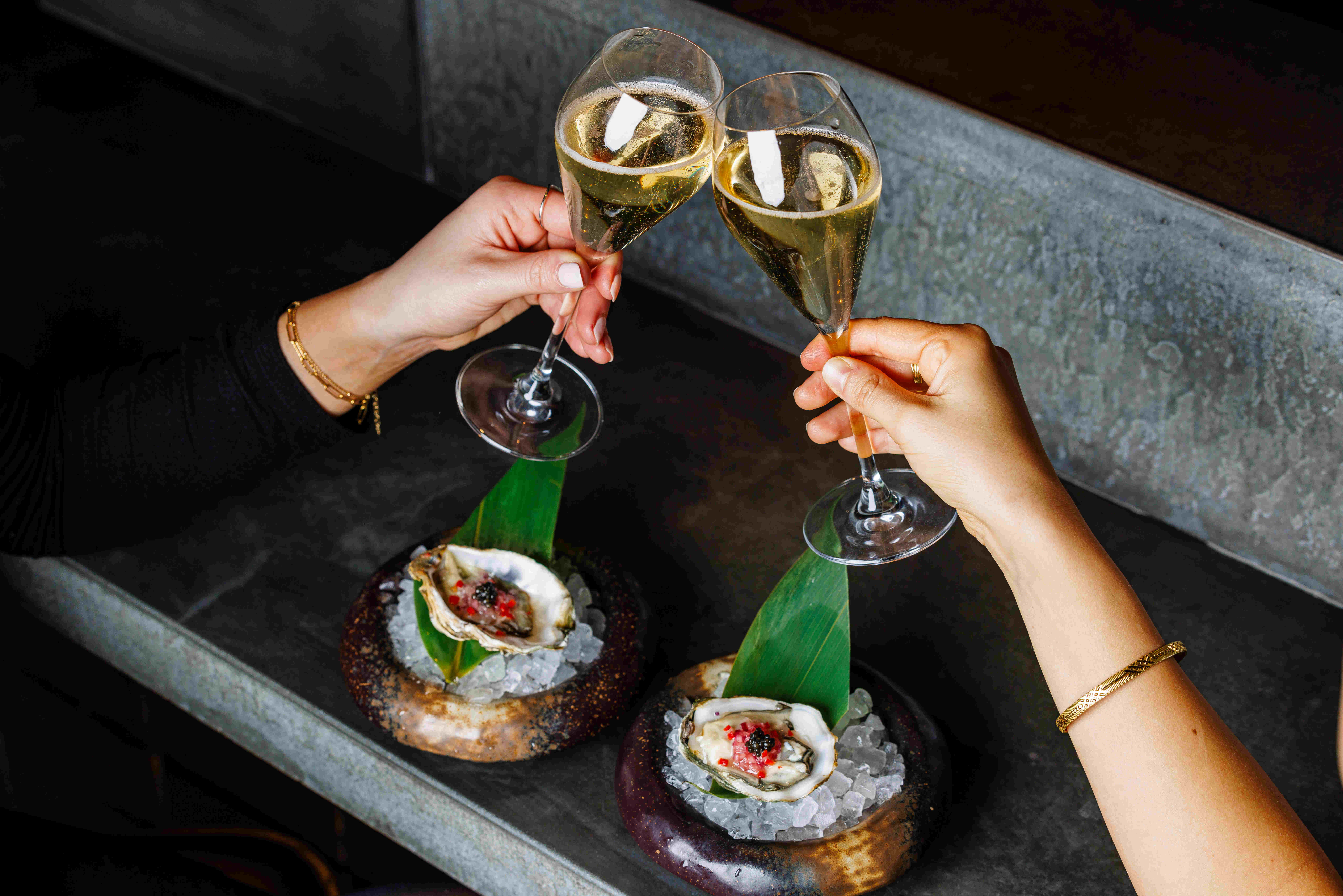 Champagne flutes and oysters at TOKii, The Prince Akatoki London event.