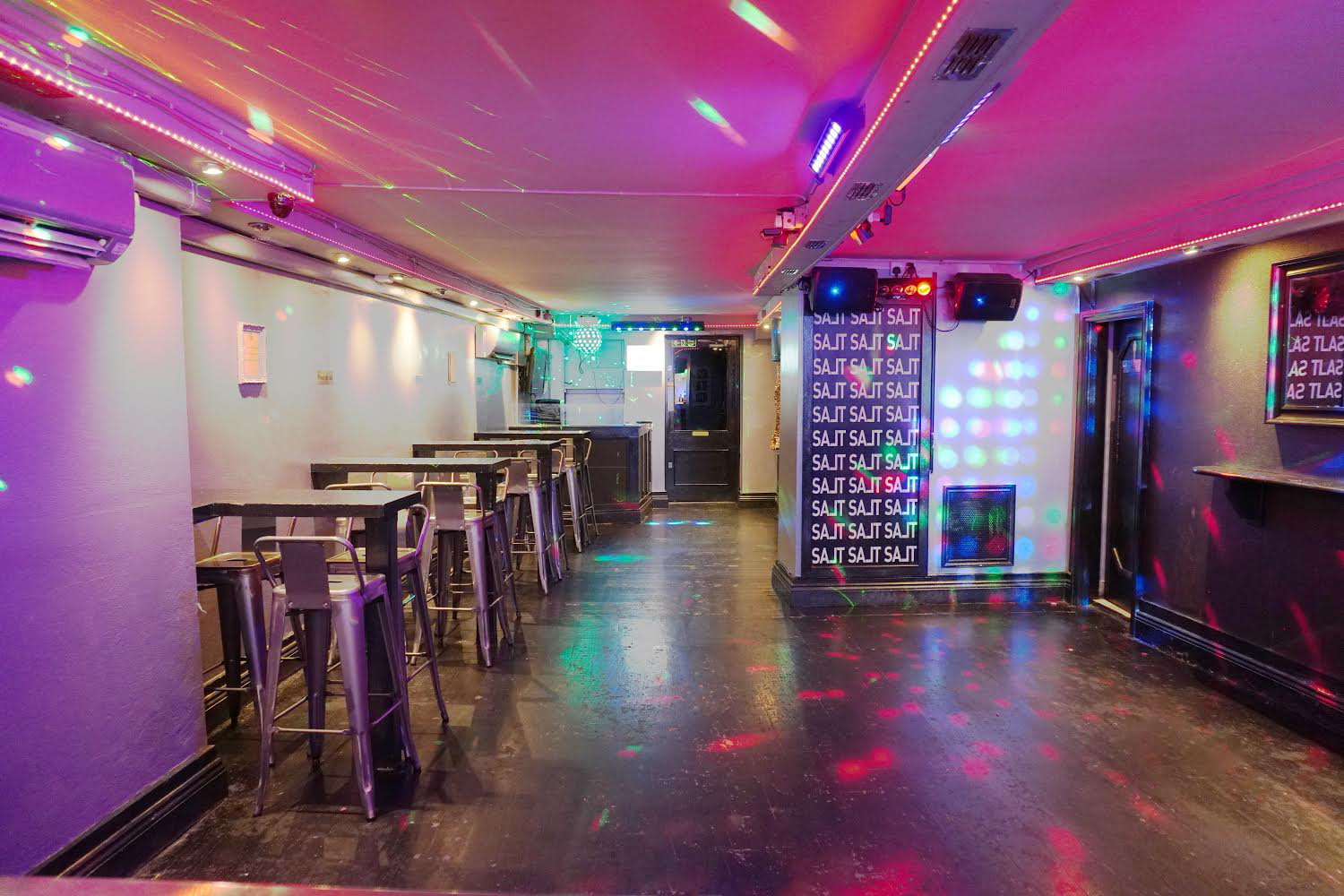 Vibrant event space in West Hampstead with colorful lighting for parties and gatherings.