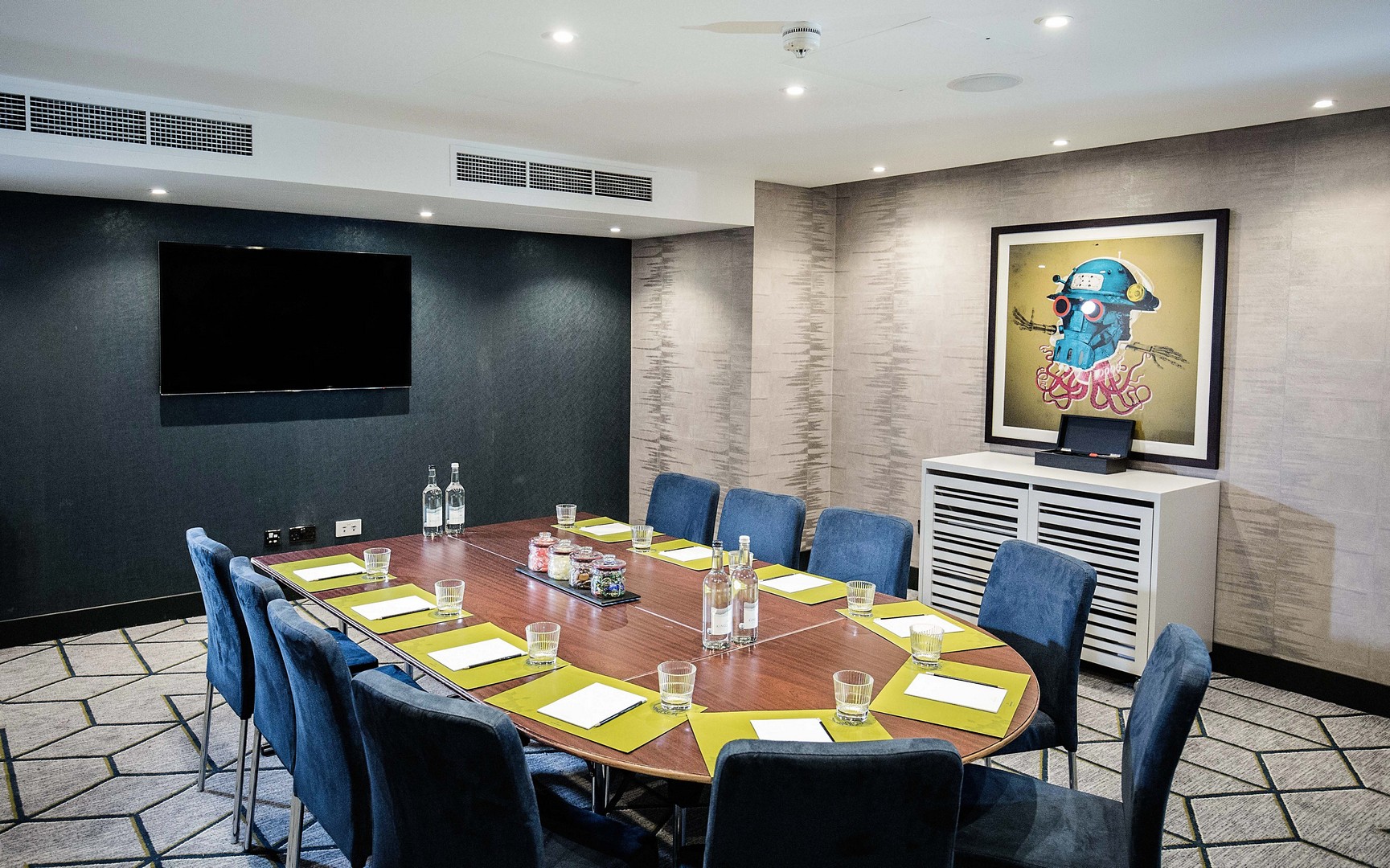 Meeting room in Malmaison Birmingham with oval table, ideal for professional gatherings.