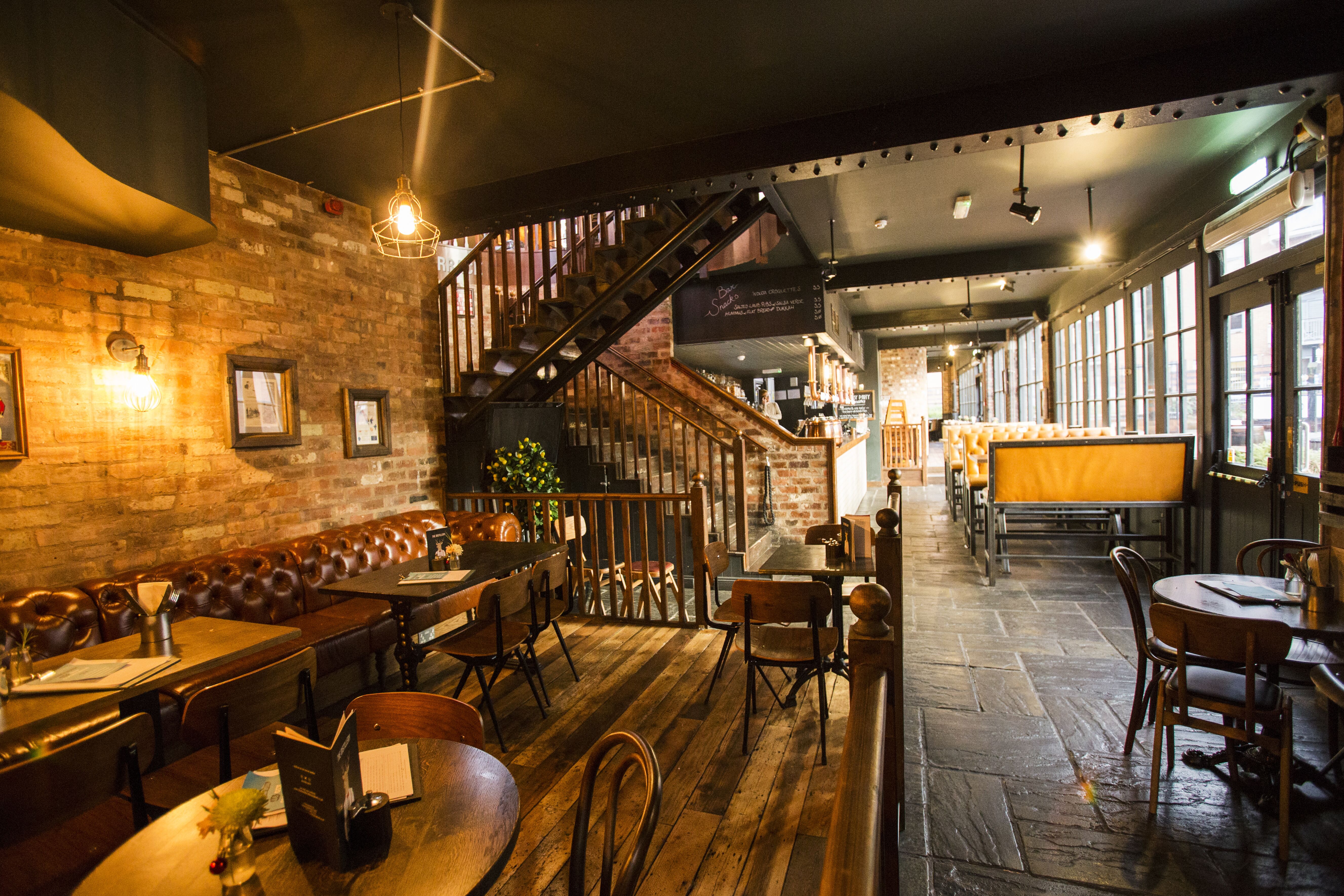 Stylish Gin Snug venue with exposed brick, perfect for networking events in Birmingham.