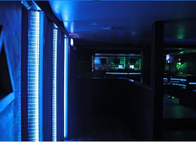 Dimly lit Metro Dalston venue with blue lighting, perfect for cocktail receptions and parties.