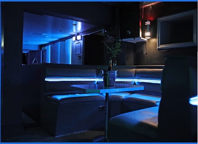 Modern lounge in Metro Dalston with blue lighting, ideal for networking events and receptions.
