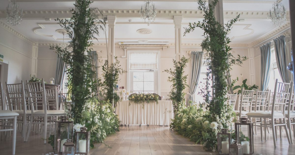 Elegant event space at Berwick Lodge, ideal for weddings with lush greenery and floral decor.