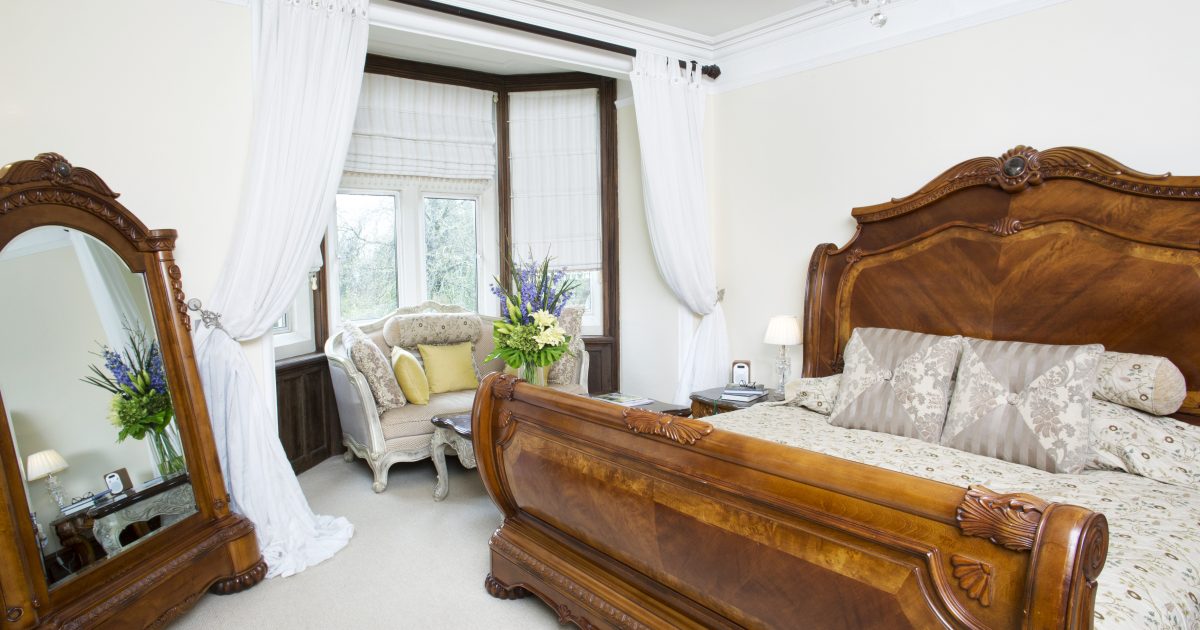 Elegant bedroom at Berwick Lodge, perfect for intimate retreats and events.