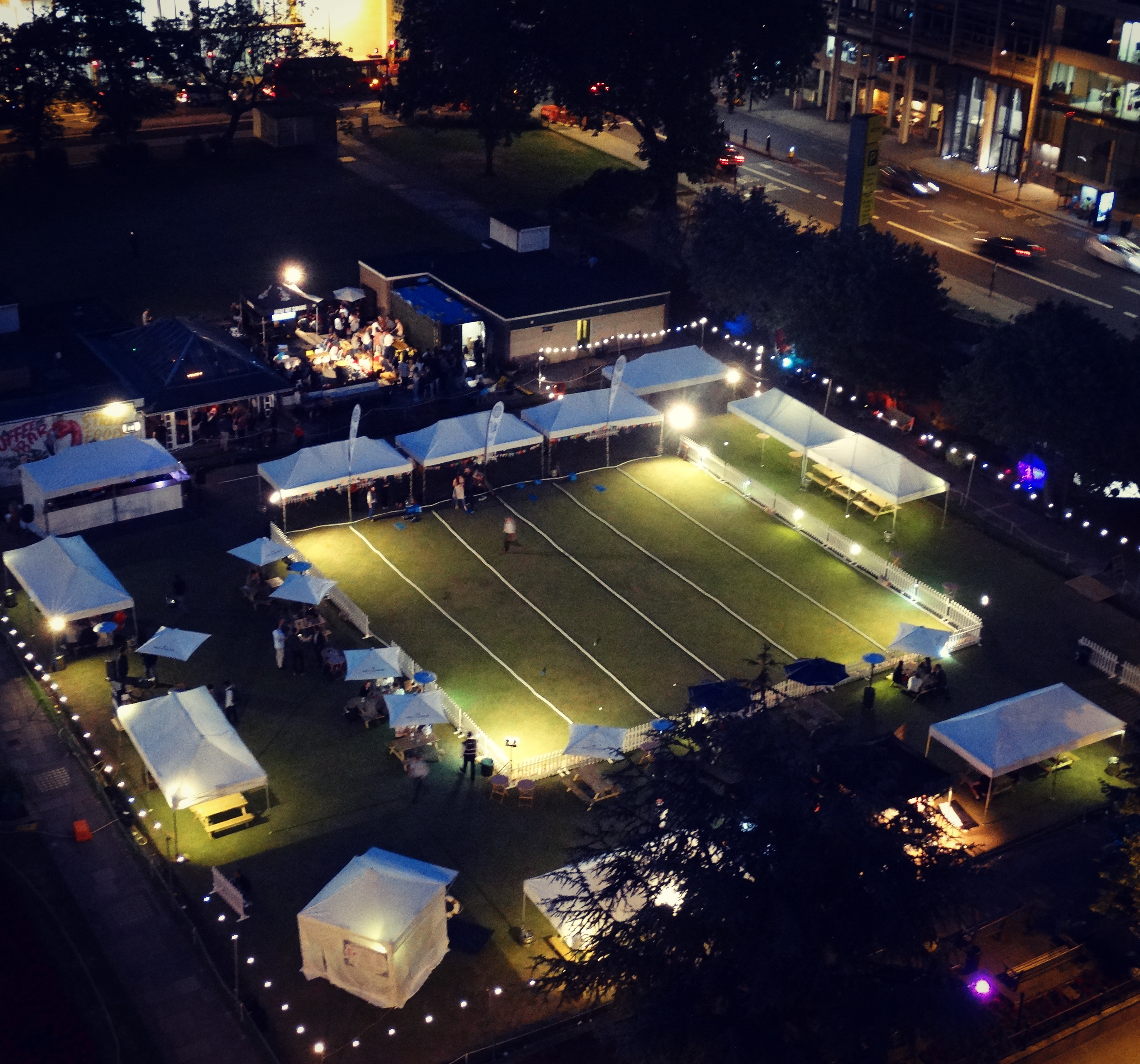 Outdoor event space at Festibowl with tents, ideal for gatherings and networking.