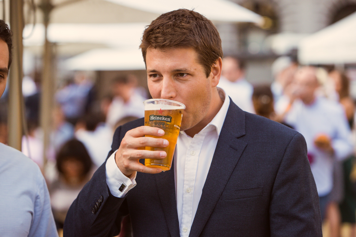 Outdoor networking event at Festibowl with attendees enjoying drinks and casual interactions.