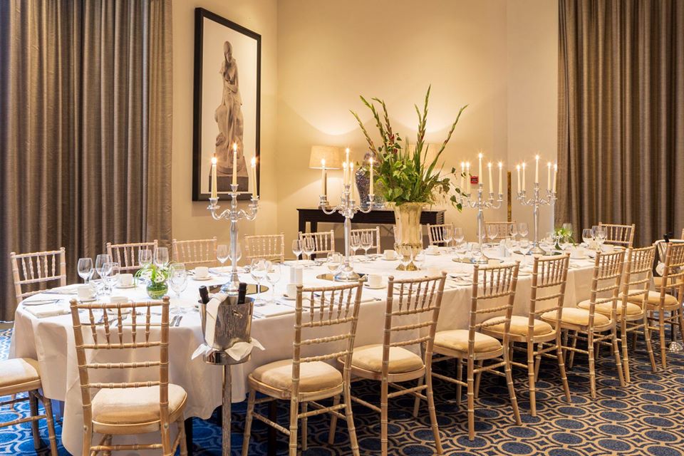 Elegant dining table setup in The Kerry Suite for formal events and corporate dinners.