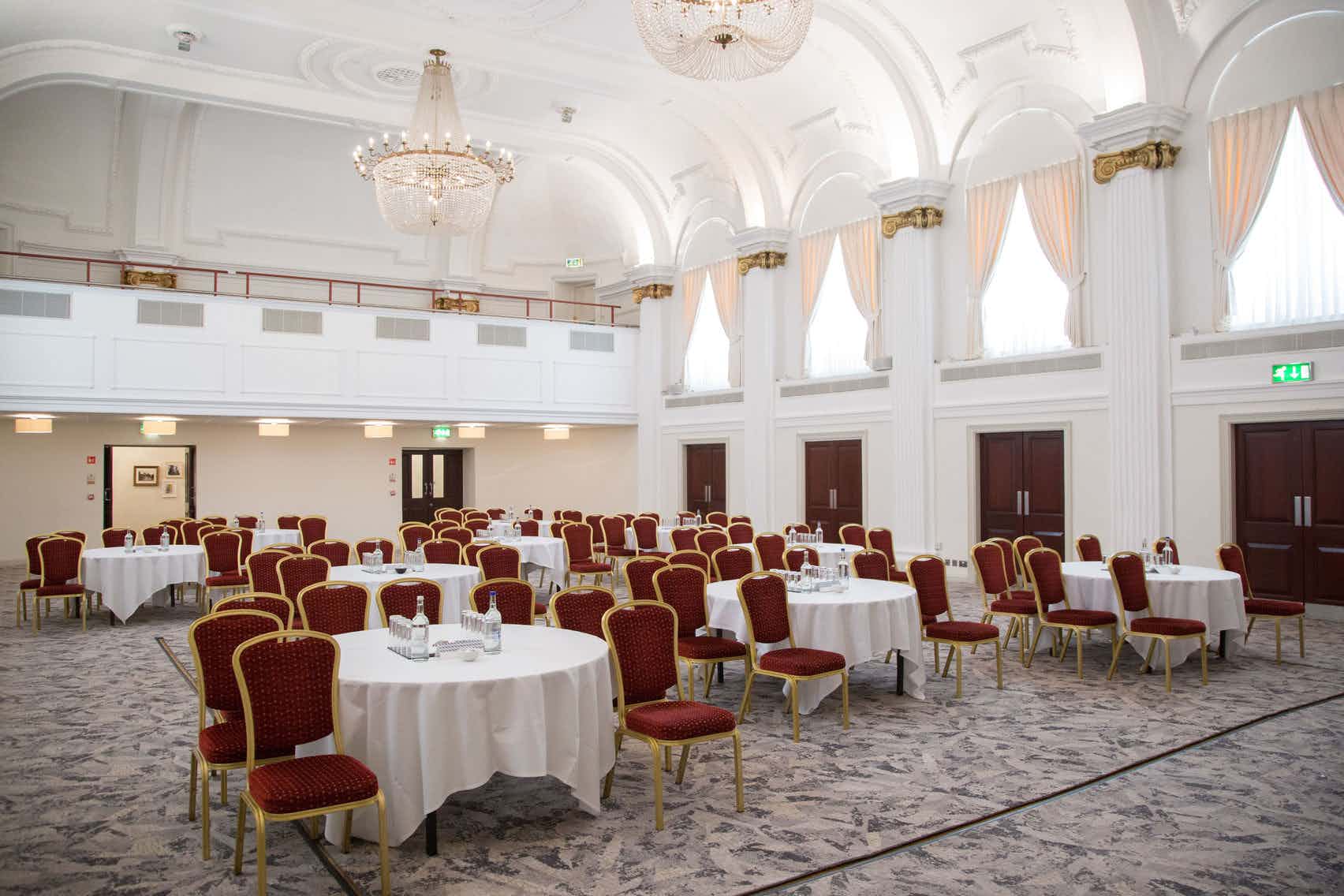 Elegant ballroom with round tables, perfect for conferences and banquets in Bristol.