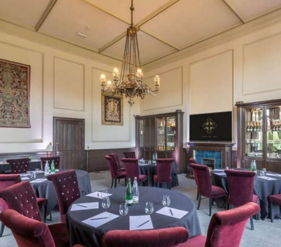 Garden Pavilion at Mar Hall: elegant meeting space with plush red chairs for events.