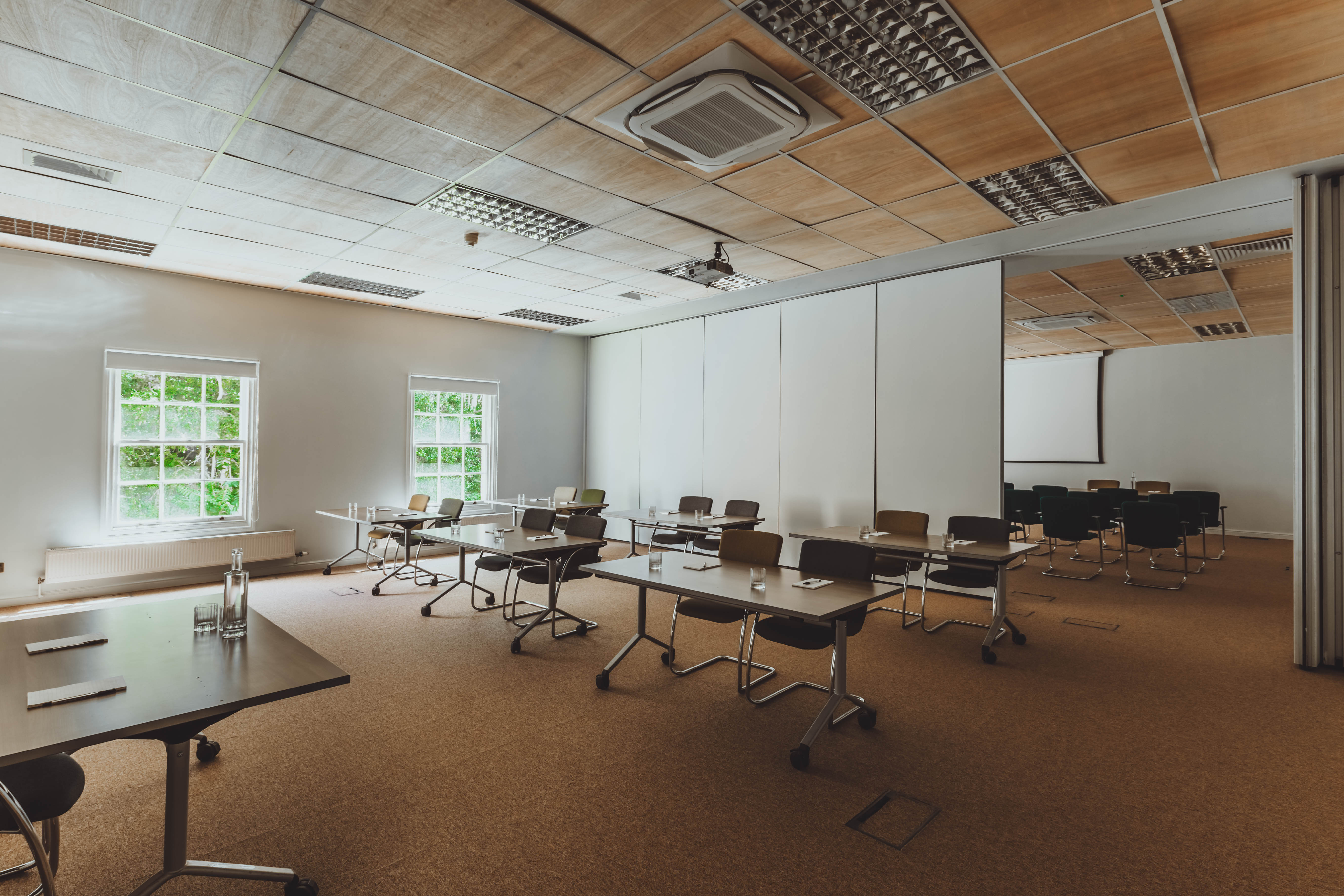 Versatile meeting room with flexible seating for workshops and seminars.