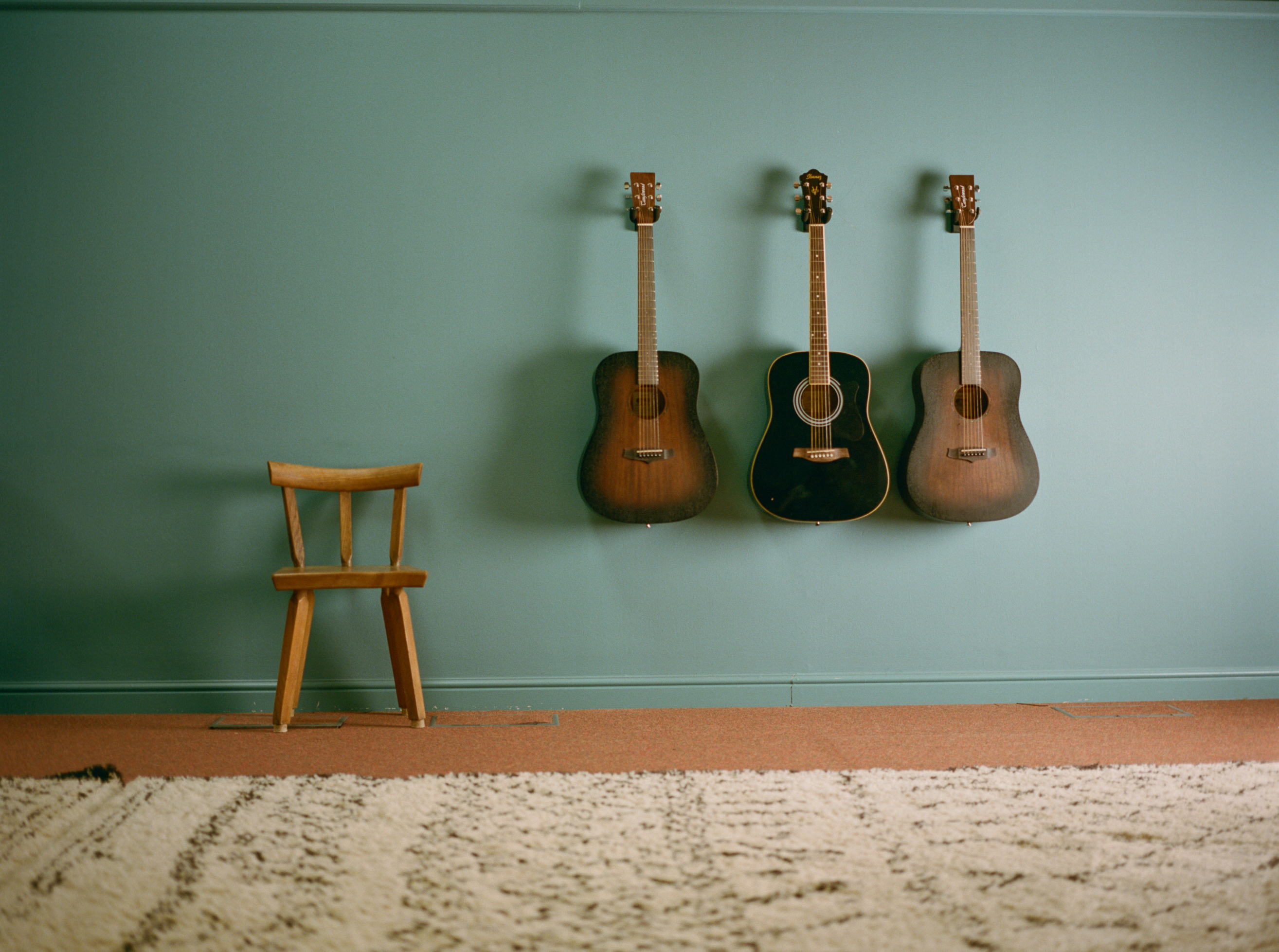 Cozy music room with guitars, perfect for acoustic sessions and creative workshops.
