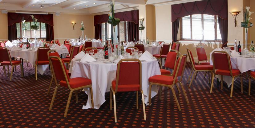 Bristol Suite at The Gables Hotel, elegant round tables for corporate events and banquets.