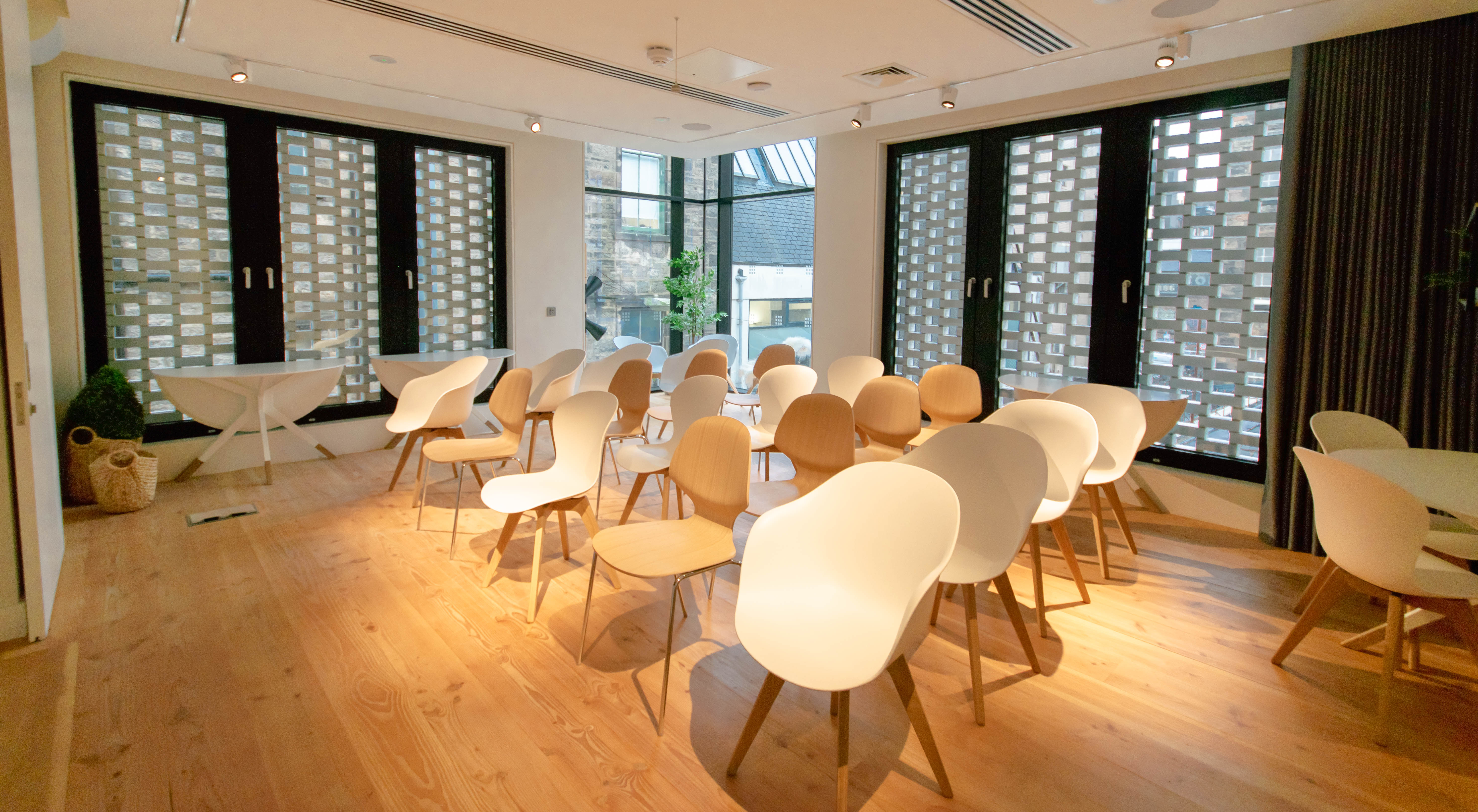 Modern meeting space at Mackintosh, ideal for workshops and discussions.