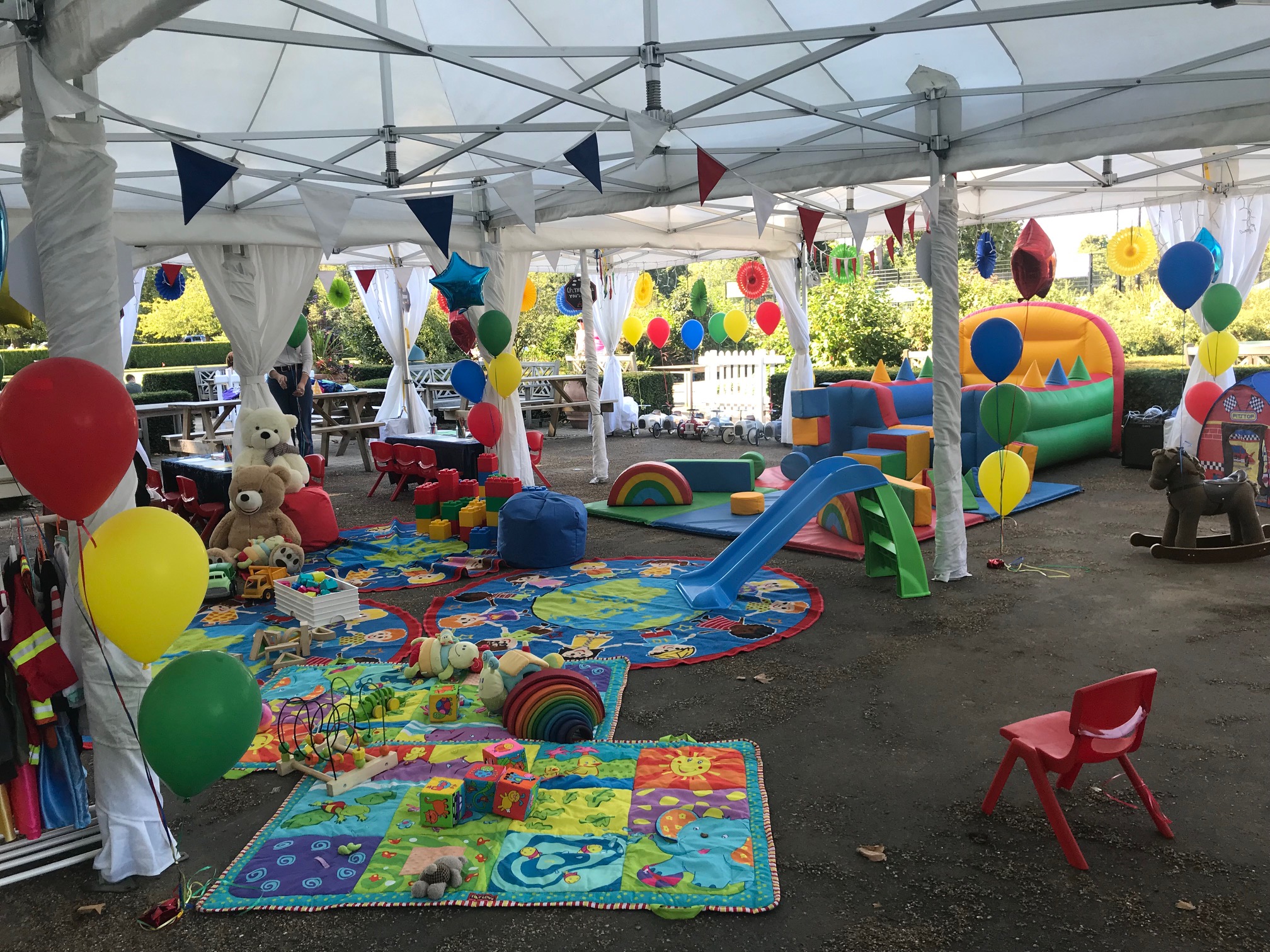 Colorful children's event space with bouncy castle for birthday parties in Hyde Park.