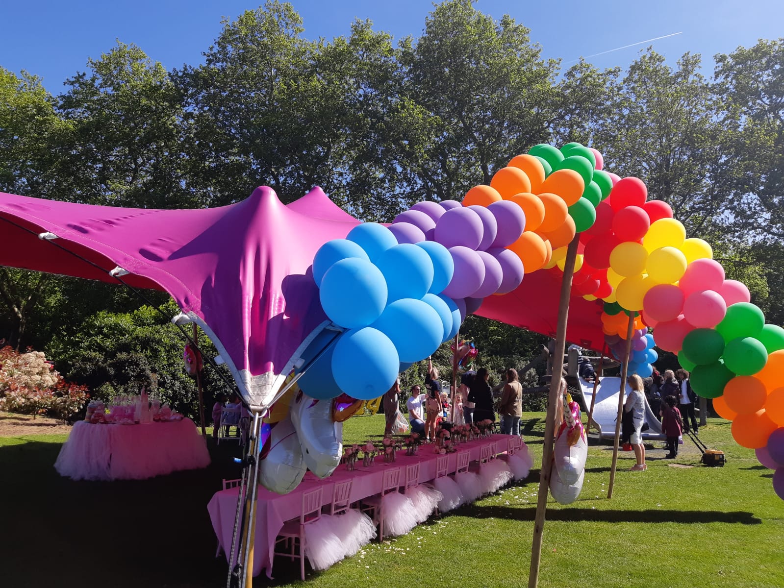 Vibrant pink tent at Pavilion Gardens for a festive birthday celebration event.