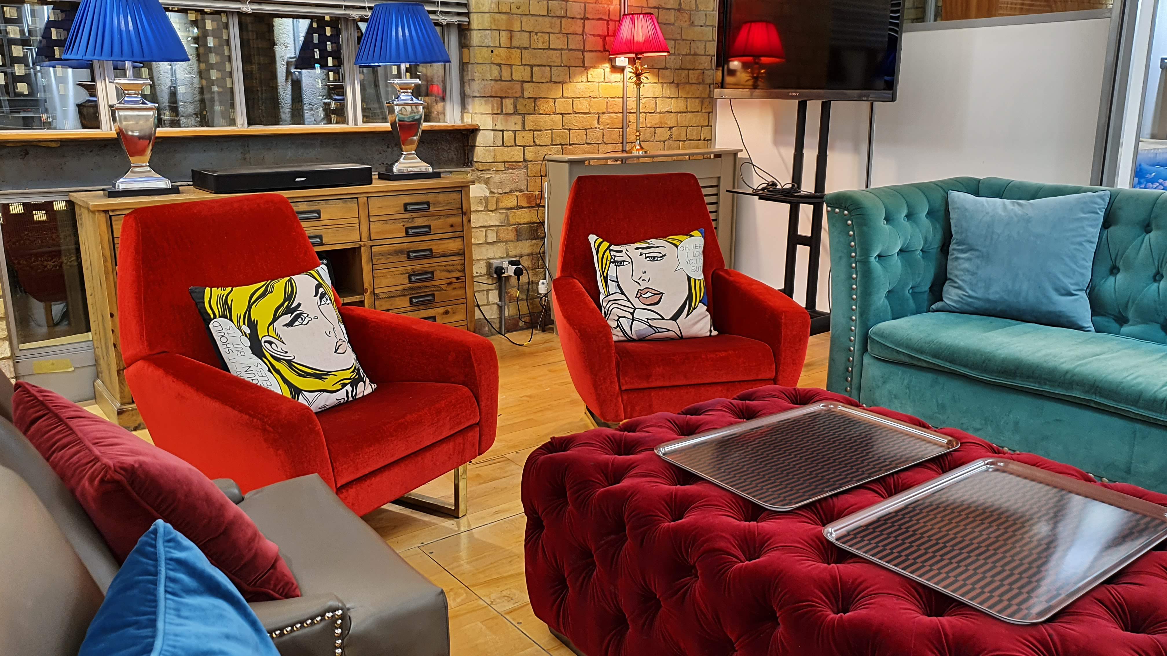 Stylish lounge area with vibrant furniture for networking events at The New Yorker Gallery.