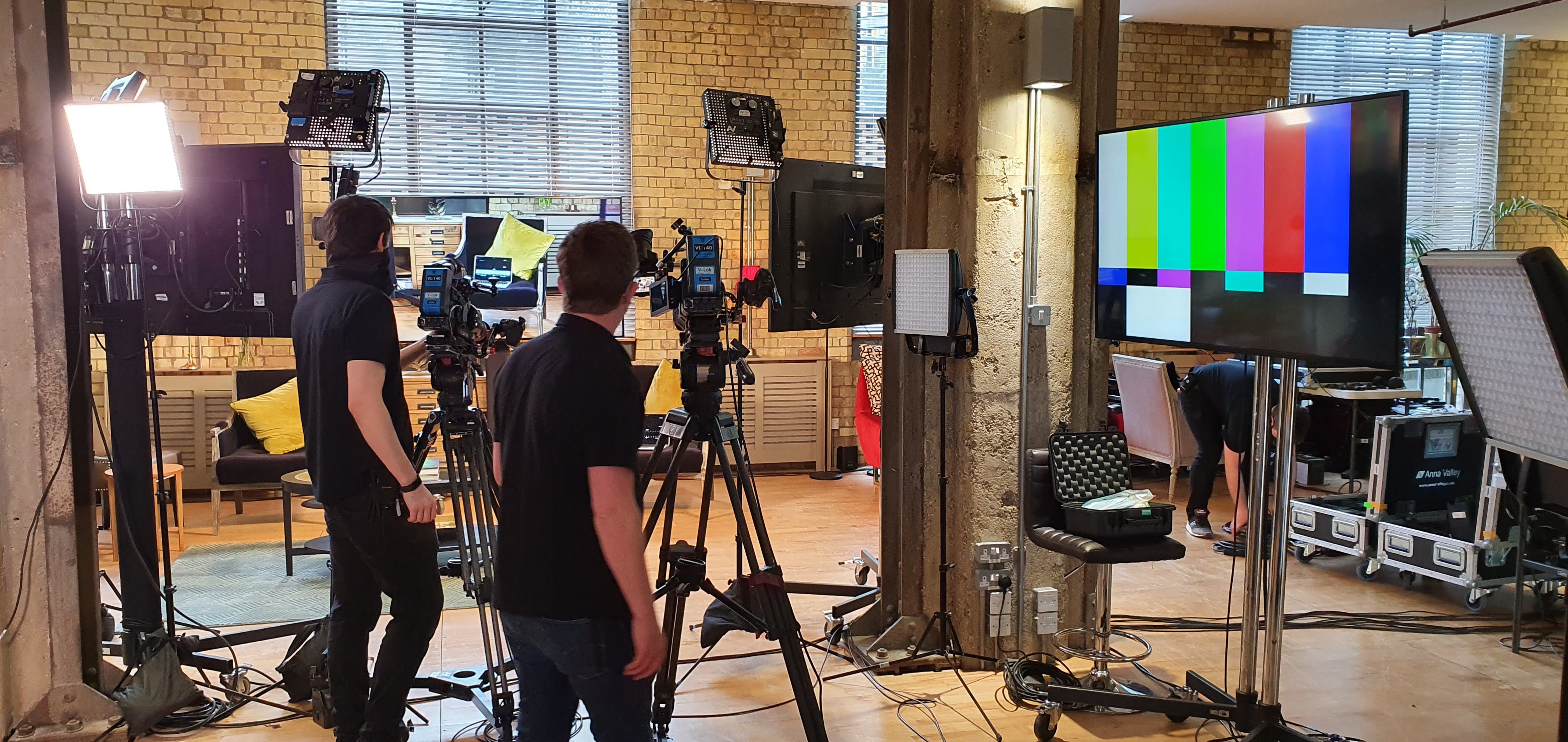 The New Yorker Gallery setup for hybrid events with cameras and a large screen.