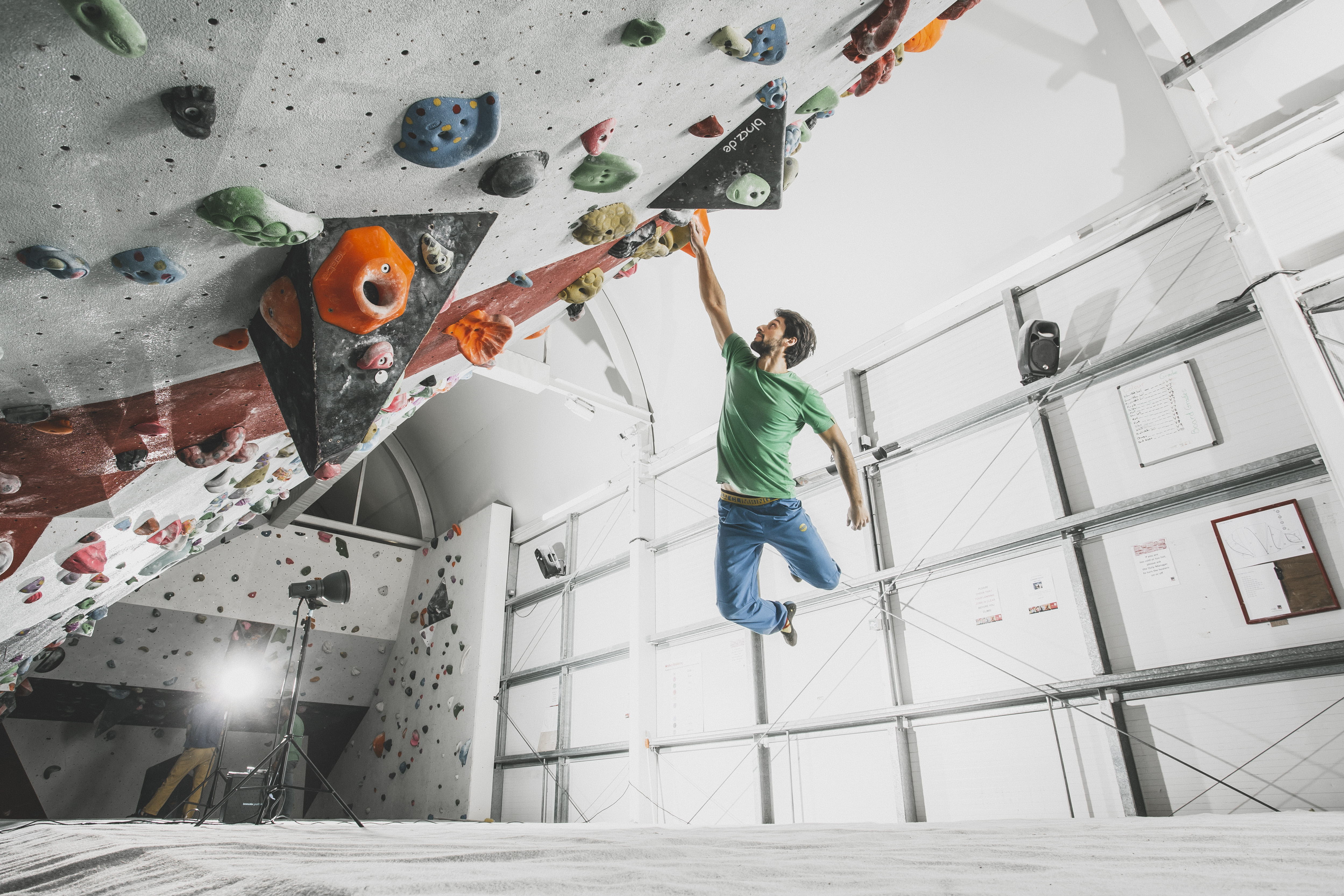 Climber bouldering at Westway Sports & Fitness Centre for team-building events.