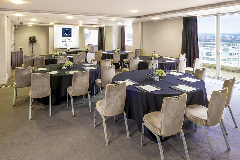 Bridges Suite meeting room with round tables, ideal for corporate events and workshops.