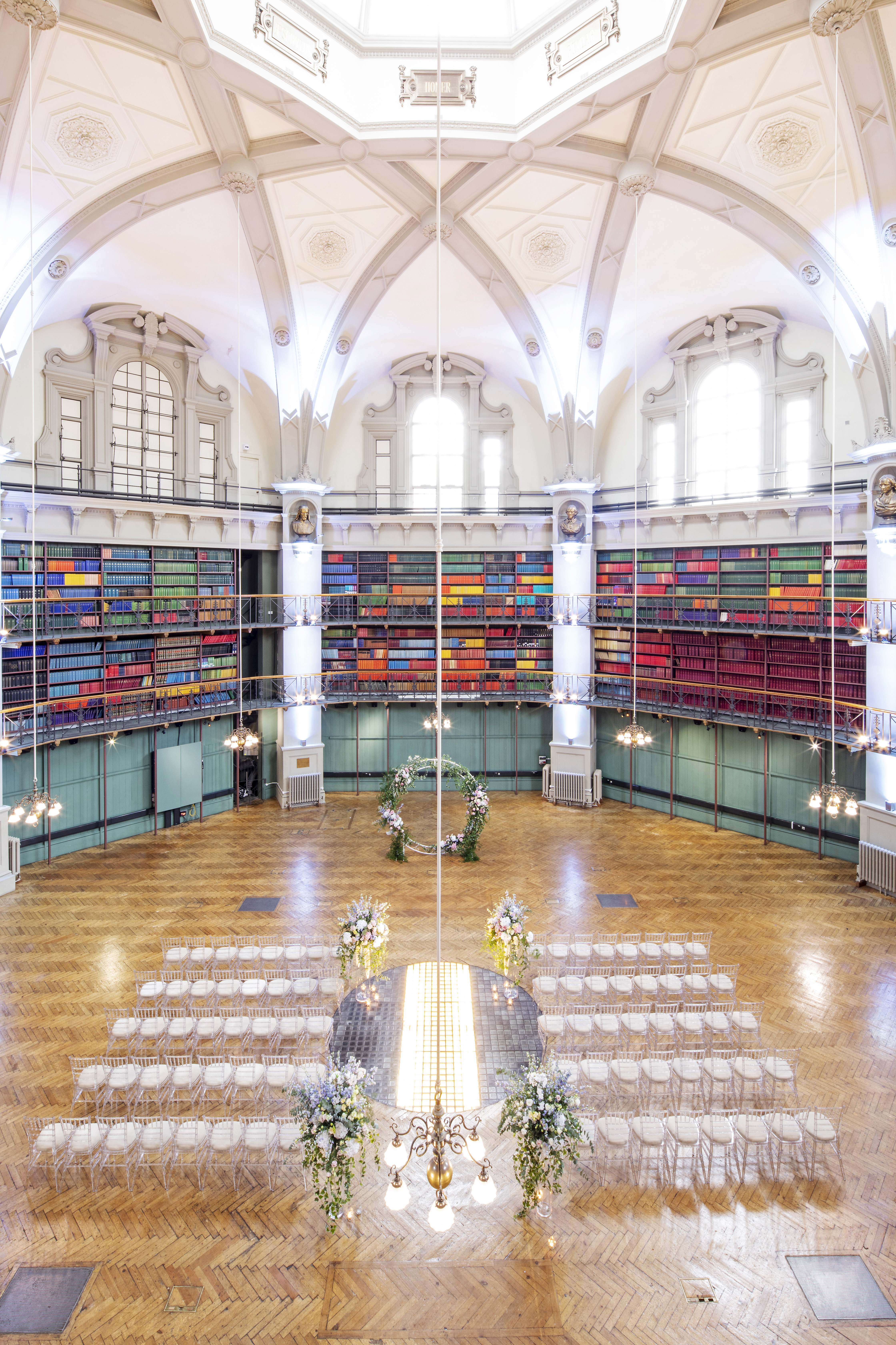 Elegant event space at Queen Mary Venues, featuring a colorful bookshelf backdrop.