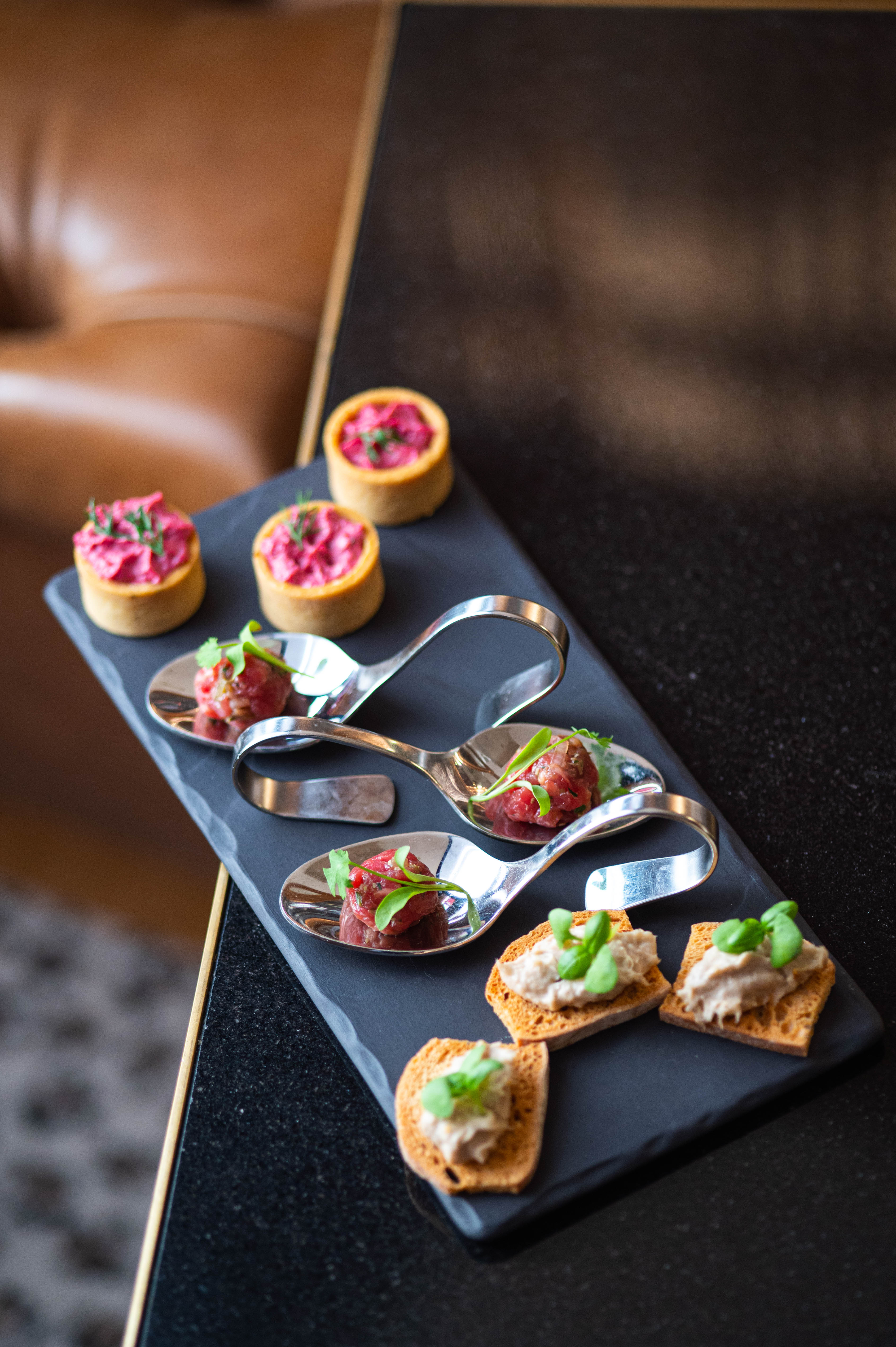 Elegant gourmet hors d'oeuvres display at The English Grill for upscale events.