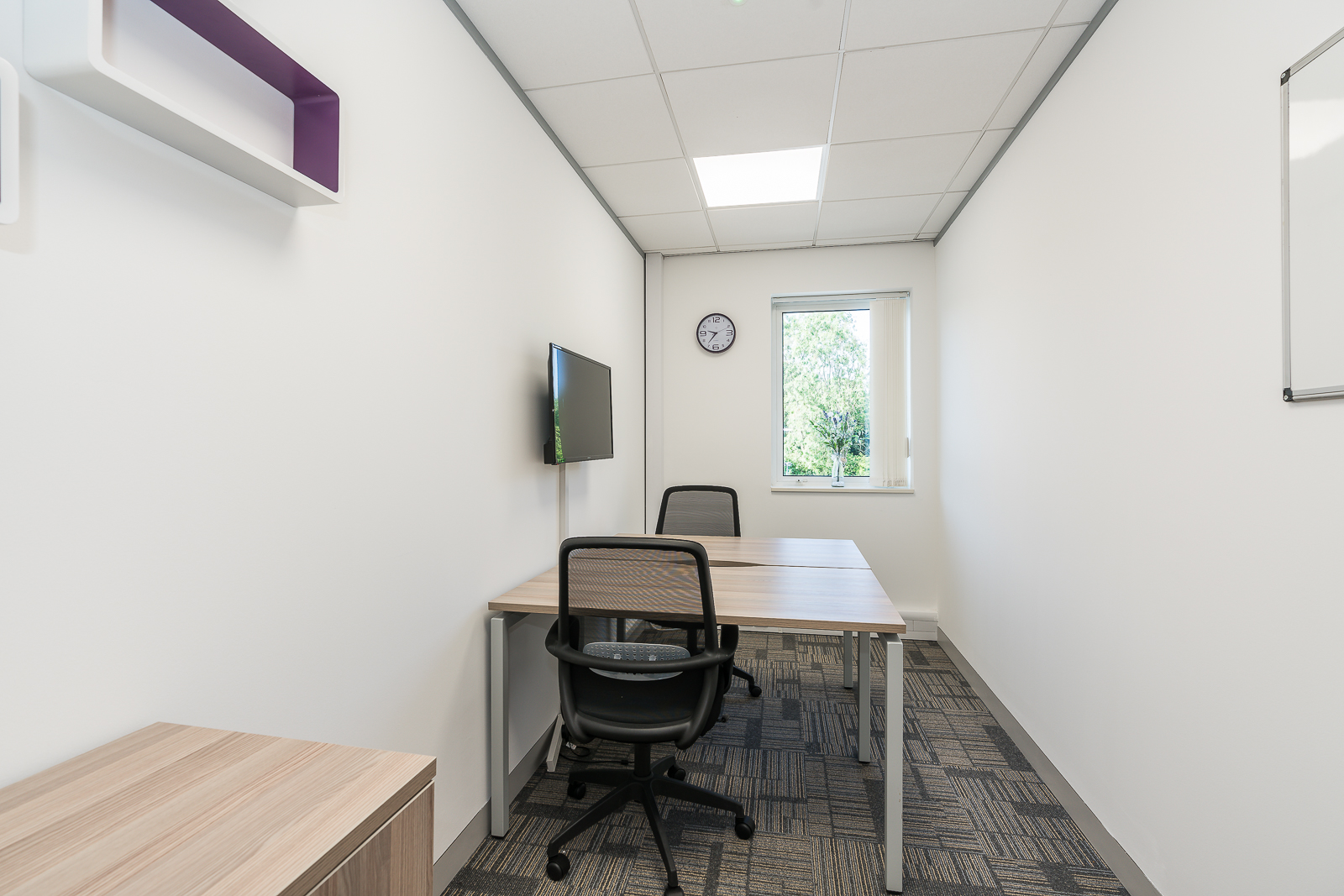 Minimalist meeting room in UBC Warrington, ideal for brainstorming and presentations.