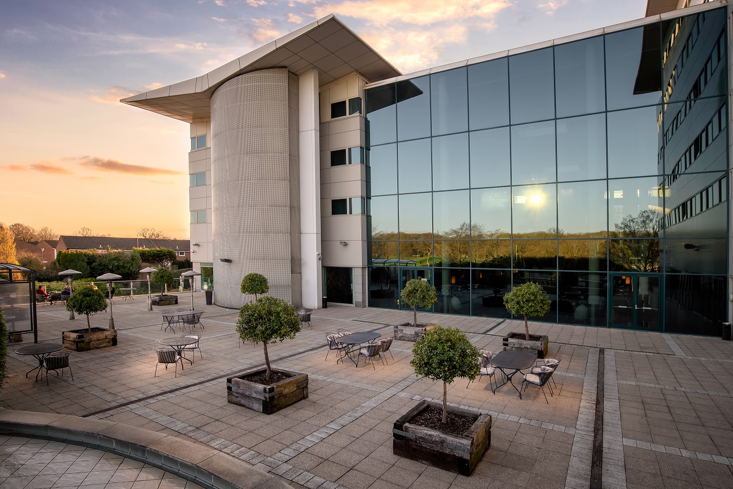 Longley Suite at Arora Hotel Gatwick, modern venue for corporate events with glass facades.