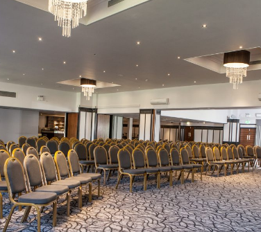 Grand Ballroom at Crowne Plaza Felbridge, elegant chairs for conferences and seminars.