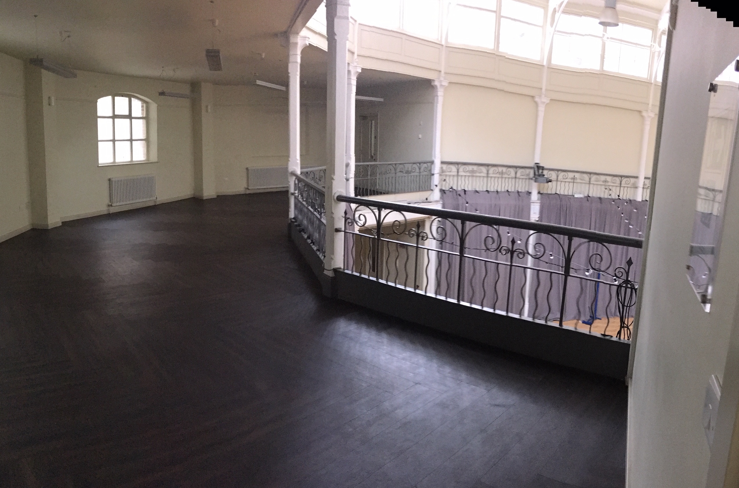 Spacious Tab Centre lecture hall with balcony, ideal for conferences and networking events.