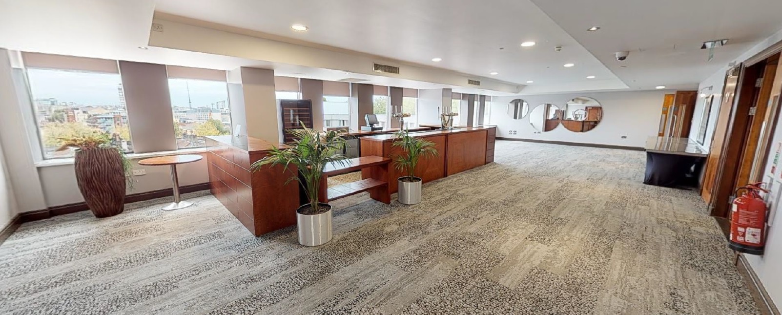 Modern event space with wooden accents and natural light at Mercure Bristol Holland House.