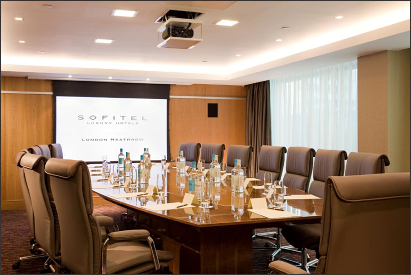 Imperial Boardroom at Sofitel London Heathrow, oval table setup for corporate events.