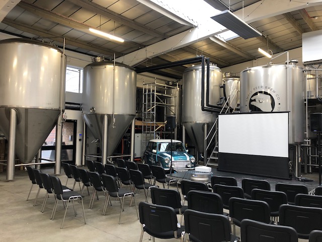 Main Brew Room at Small Beer Brewery with industrial tanks for events and workshops.