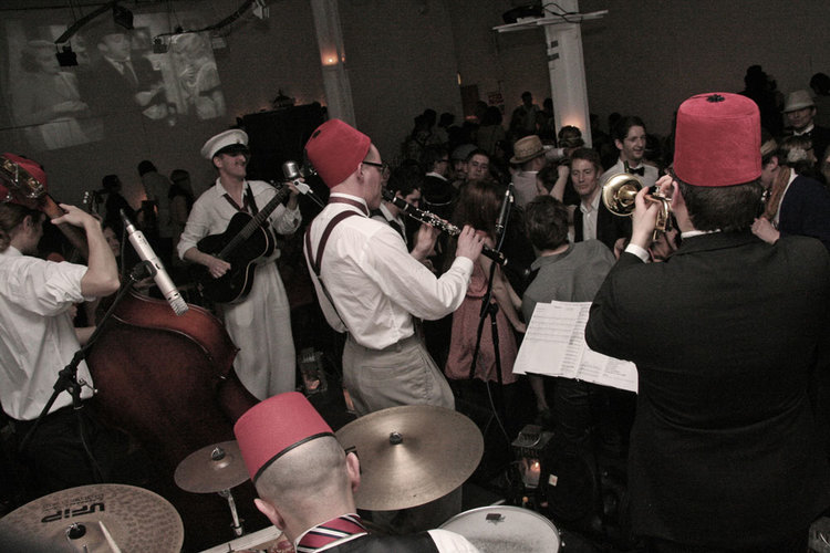 Lively band performance at Ground Floor Gallery, festive atmosphere for social events.